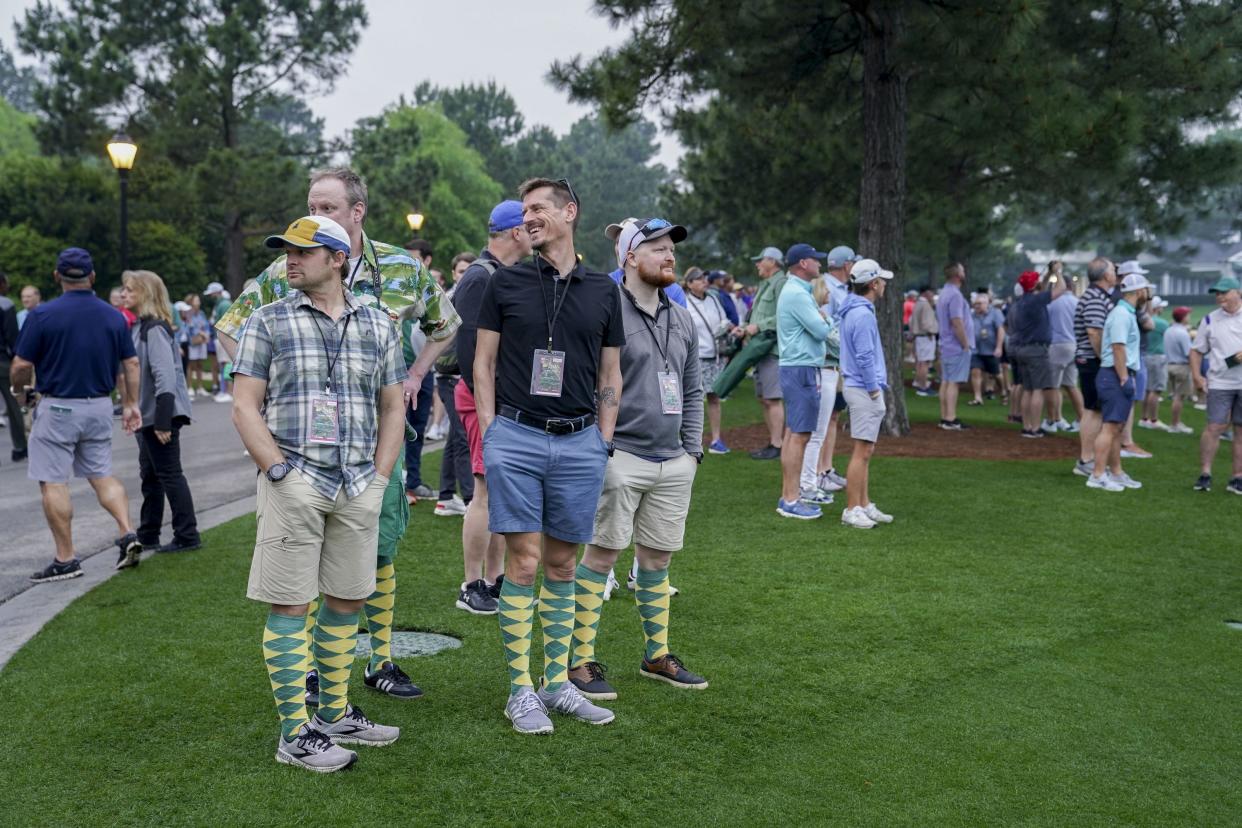 FILE - Apr 4, 2023; Augusta, Georgia, USA; Patrons watch the action on the practice green during a practice round for The Masters golf tournament at Augusta National Golf Club. Mandatory Credit: Katie Goodale-USA TODAY Network