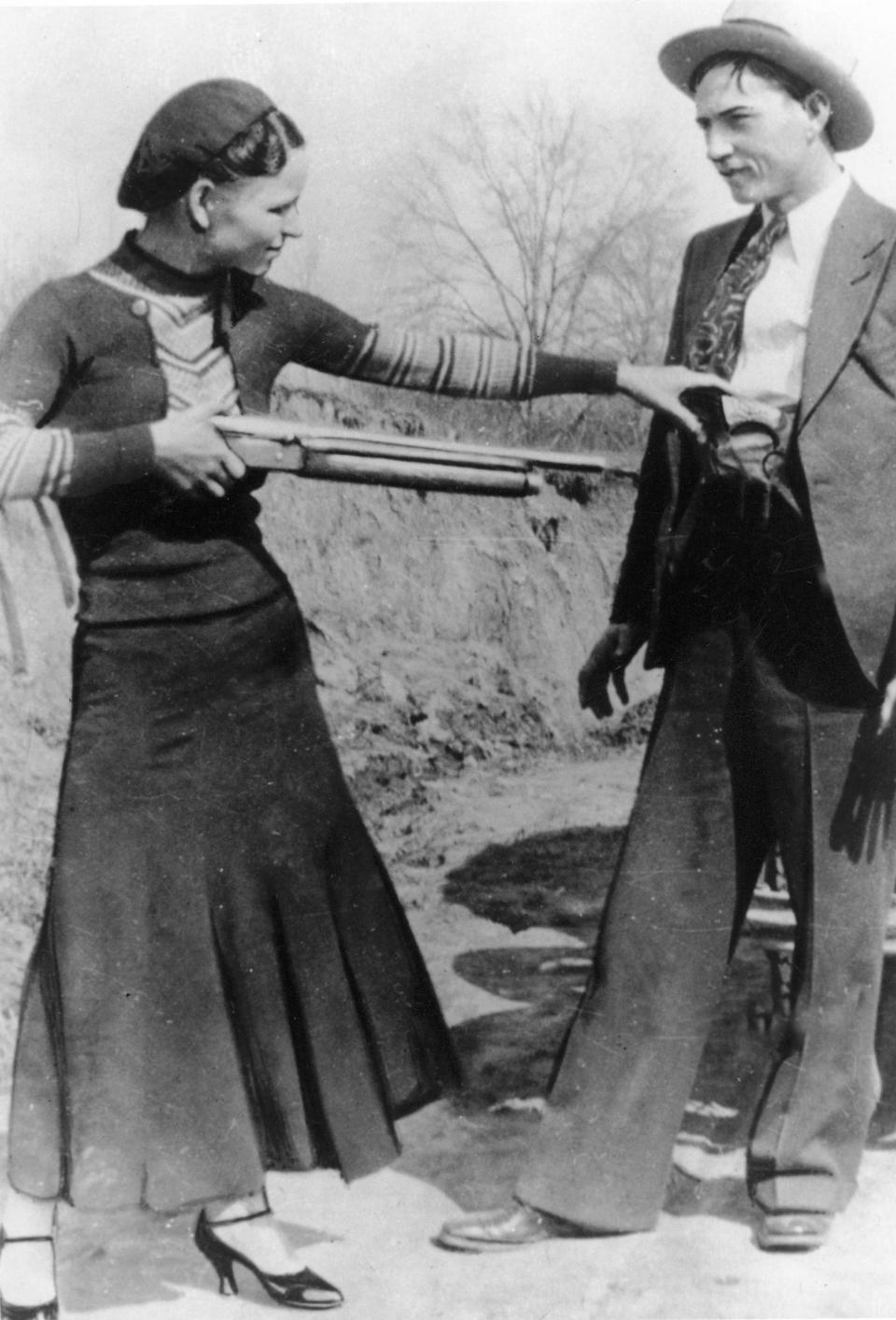 FILE - This this undated file photo shows outlaws and lovers Bonnie Parker, left, and Clyde Barrow. Guns and other items connected to the couple are going on auction by RR Auction of Amherst, N.H. An auction official estimated Thursday, July 12, 2012, that the handguns found on the duo after they were shot dead each could fetch between $100,000 and $200,000. (AP Photo/File)