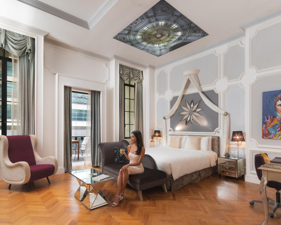 A photo of a model at the balcony suite at Hotel Telegraph. (PHOTO: Hotel Telegraph)