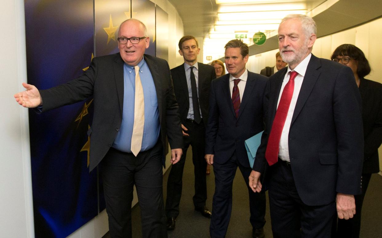 Frans Timmermans (left) welcomes Jeremy Corbyn to European Commission headquarters in July.  - Reuters