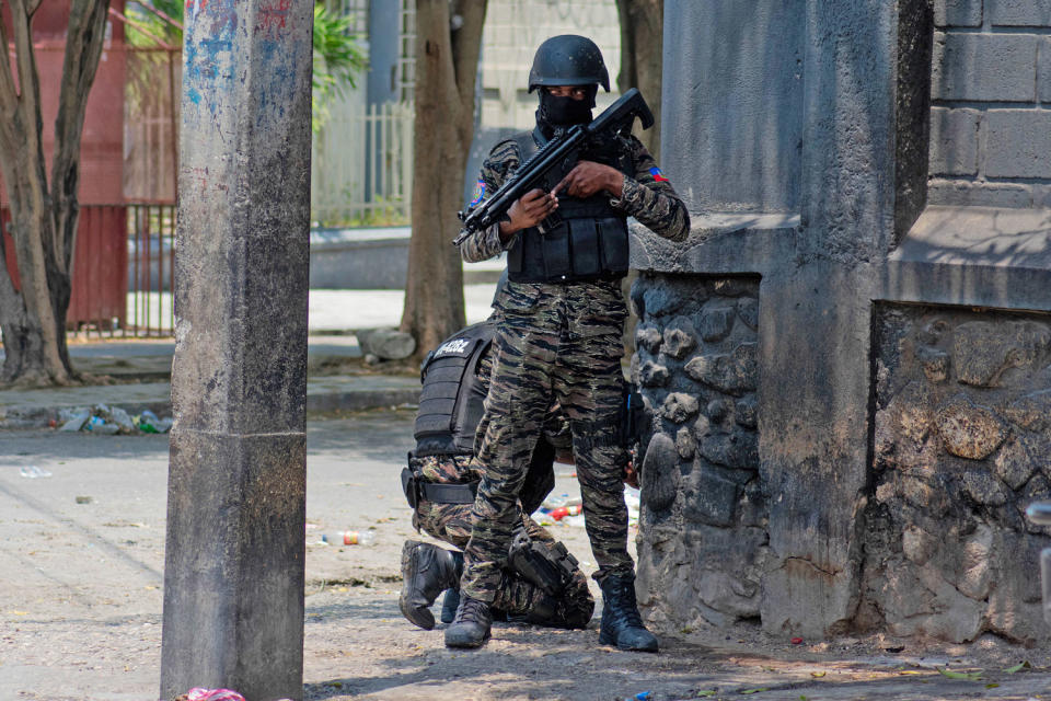 Haitian police stand guard on a street corner amid gang violence in Port-au-Prince on April 8,2024.  (Clarens Siffroy / AFP via Getty Images)