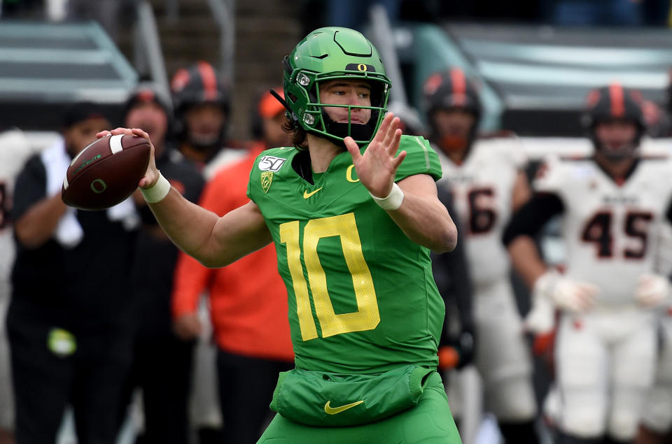 Oregon quarterback Justin Herbert could have been the top quarterback in the 2019 class, but he returned to school. (Photo by Steve Dykes/Getty Images)