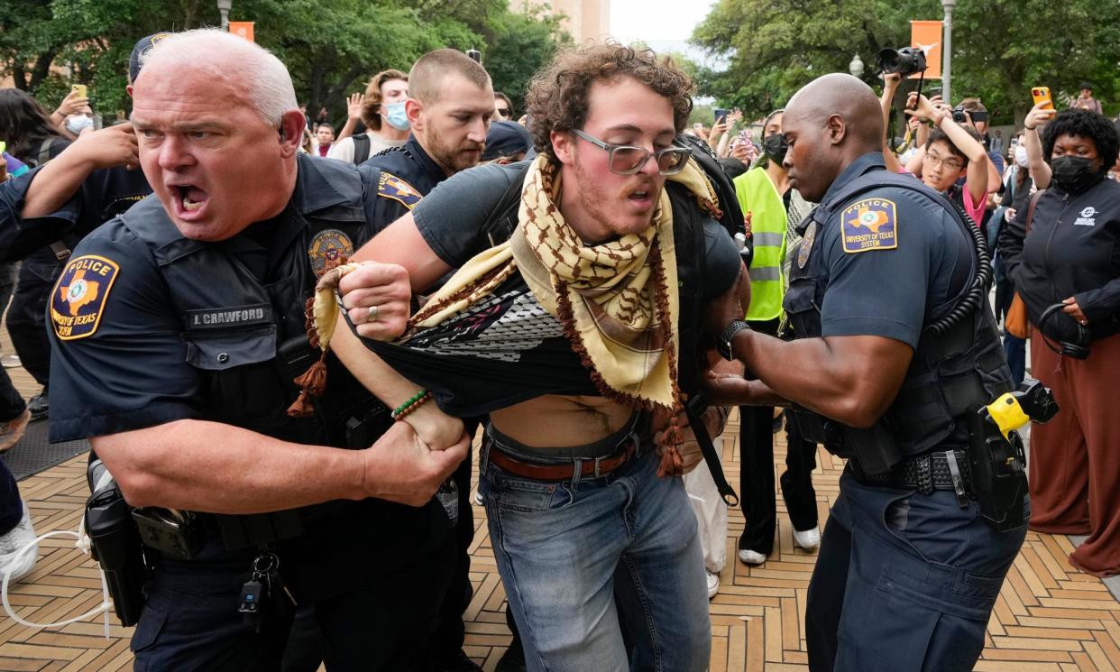 <span>University of Texas police officers arrest a man at a pro-Palestinian protest on campus on Wednesday in Austin.</span><span>Photograph: Jay Janner/AP</span>