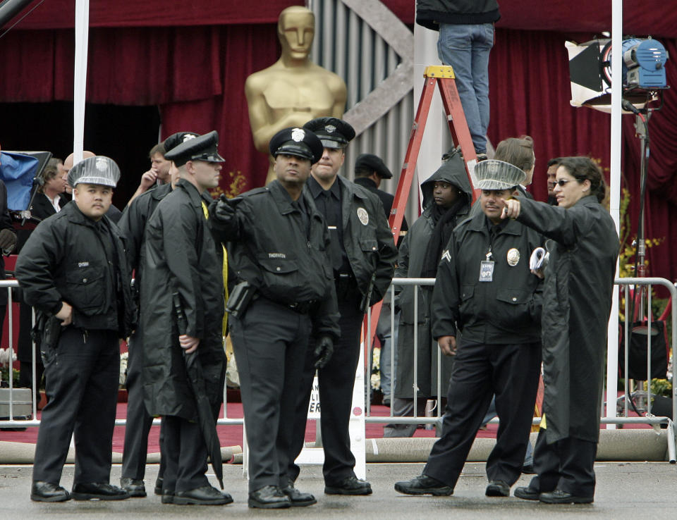 Los Angeles Police Department officers gather outside the Kodak Theatre for the 80th Annual Academy Awards Sunday, Feb. 24, 2008, in the Hollywood section of Los Angeles. (AP Photo/Ric Francis)