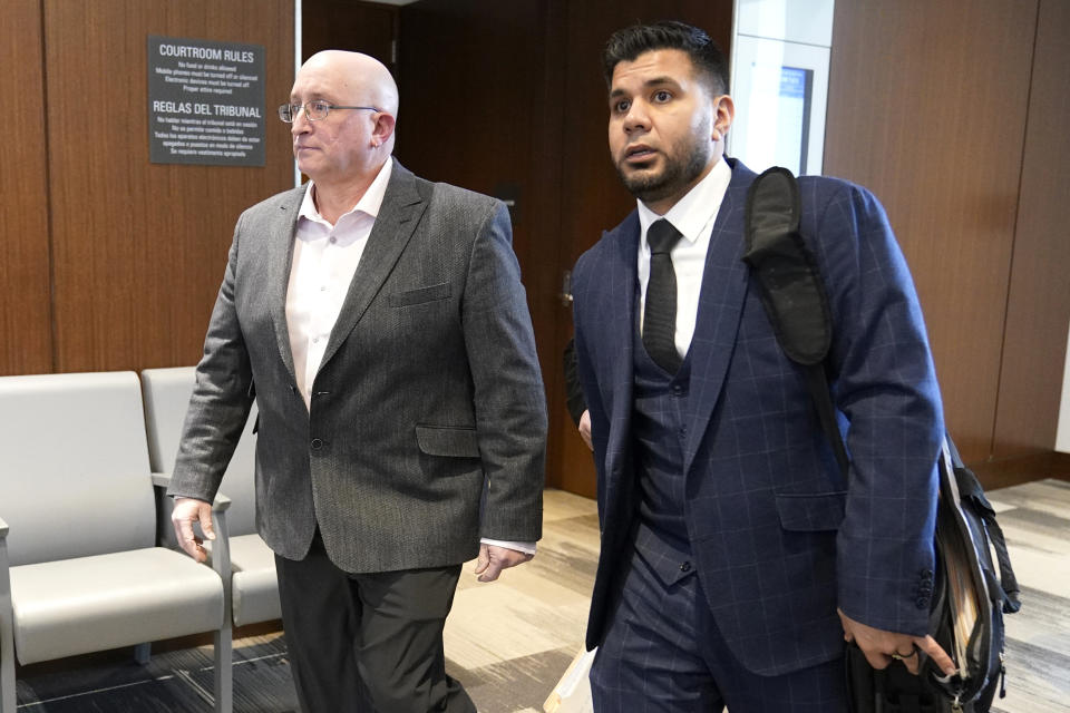 Robert E. Crimo Jr., left, father of Robert Crimo III, and his attorney George Gomez depart a Lake County, Ill., Courthouse courtroom after an appearance before Judge George D. Strickland Thursday, Jan. 26, 2023, in Waukegan, Ill. Crimo Jr., faces seven counts of felony reckless conduct for signing the application for his son's firearm owners ID card in December of 2019. (AP Photo/Nam Y. Huh, Pool)