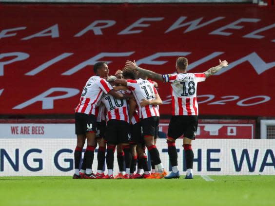 Bryan Mbeumo (obscured) of Brentford celebrates with his team mates (Getty Images)