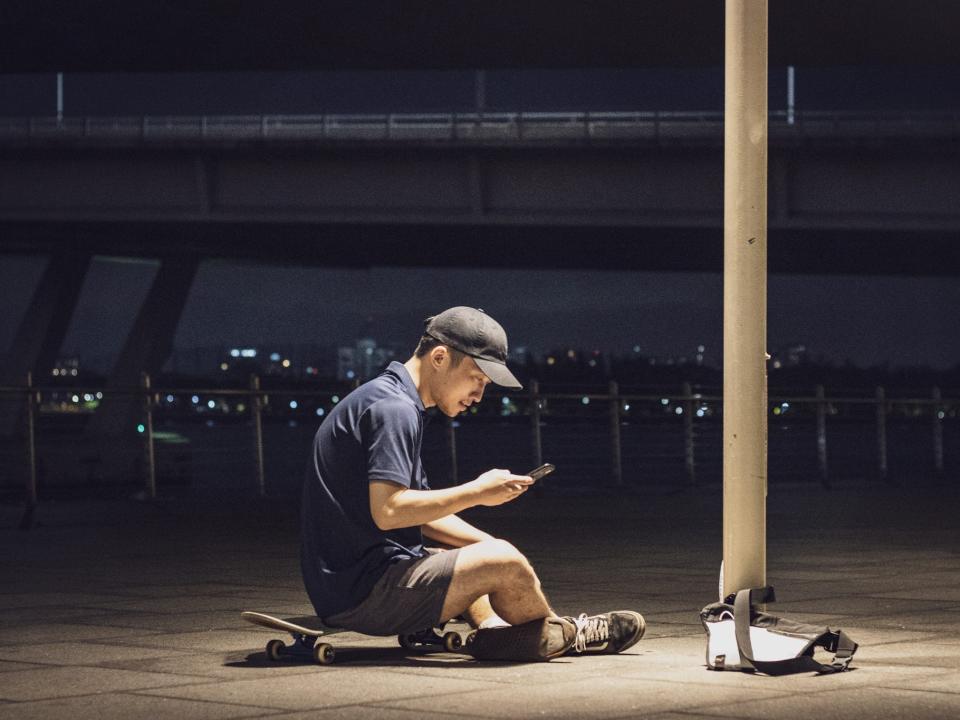 Steven relaxing in Marina Bay while waiting for other skateboarders to arrive.