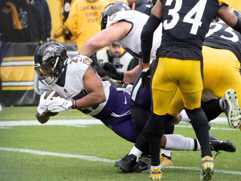 J.K. Dobbins dives across the goal line against the Pittsburgh Steelers.