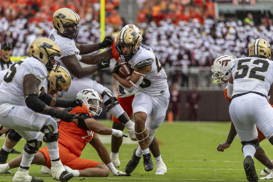 Purdue's Devin Mockobee (45) runs for a touchdown during game against Virginia Tech during the first half of an NCAA college football Saturday, Sept. 9, 2023, in Blacksburg, Va. (AP Photo/Robert Simmons)