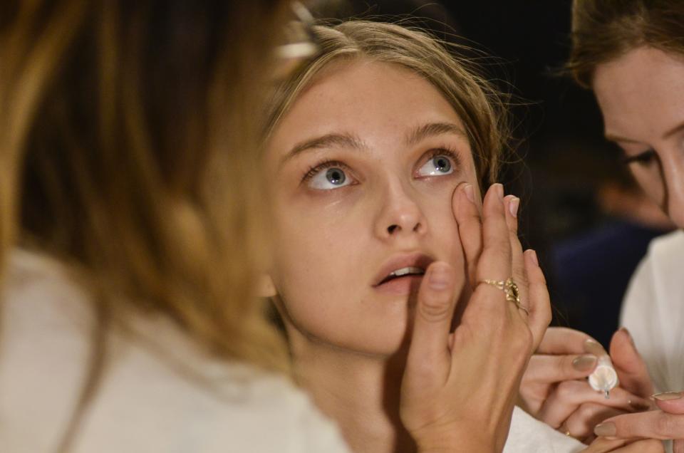 NEW YORK, NY -  SEPTEMBER 11: A model gets makeup done backstage during the Jenny Packham fashion show during new York Fashion Week September 2016 at Skylight at Moynihan Station in New York City on September 11, 2016. (Photo by Kris Connor/FilmMagic)