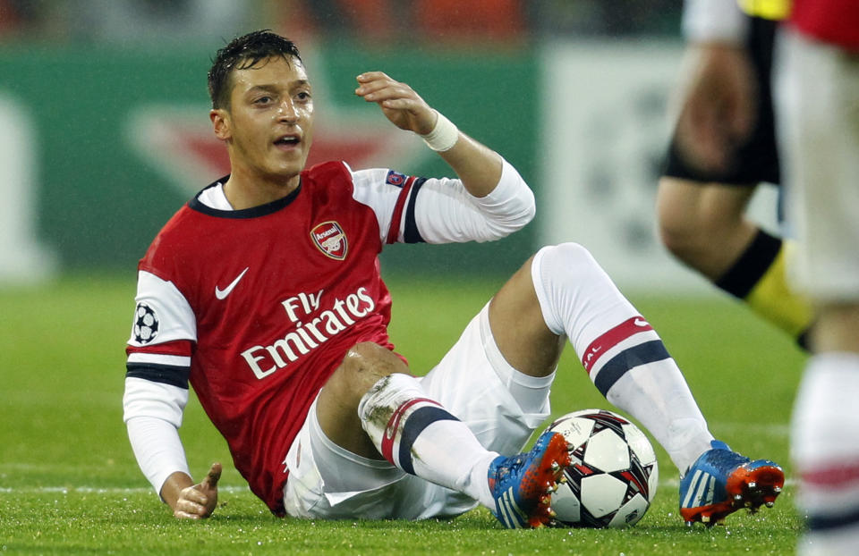 Arsenal's Mesut Oezil reacts during the Champions League Group F soccer match against Borussia Dortmund, in Dortmund November 6, 2013. REUTERS/Ina Fassbender (GERMANY - Tags: SPORT SOCCER)