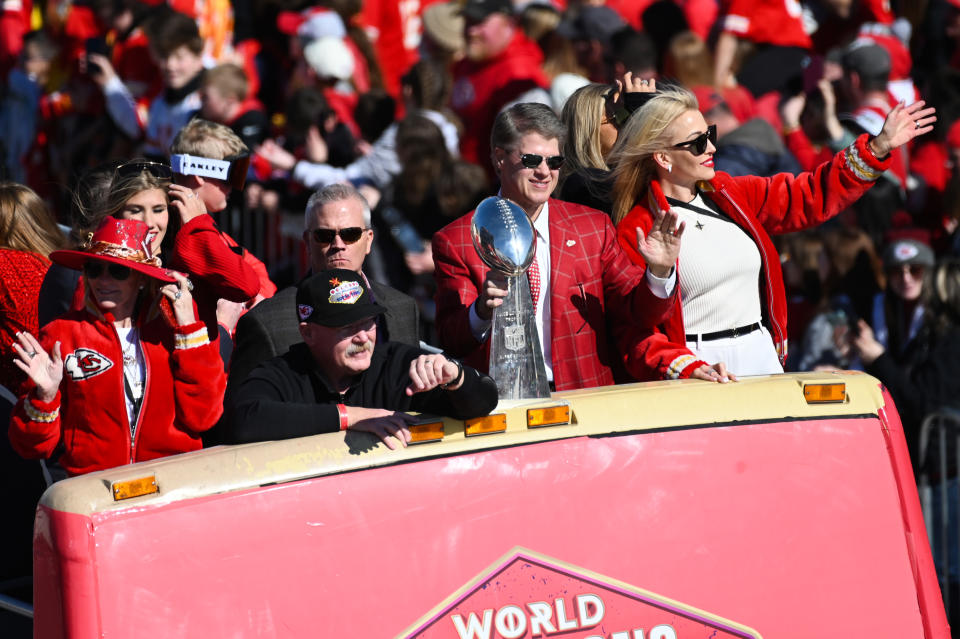 KANSAS CITY, MISSOURI - FEBRUARY 14: Head coach Andy Reid and owner Clark Hunt of the Kansas City Chiefs wave to fans during the Kansas City Chiefs Super Bowl LVIII victory parade on February 14, 2024 in Kansas City, Missouri. (Photo by Eric Thomas/Getty Images)