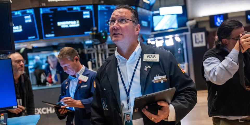 Traders work on the floor of the New York Stock Exchange on October 20, 2023.