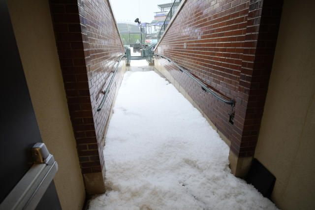 Rockies pitcher, catcher play in piles of hail at Coors Field 