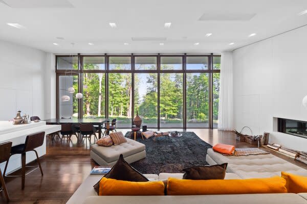 Hardwood floors line the 4,071-square-foot interior, popping against the crisp white walls.