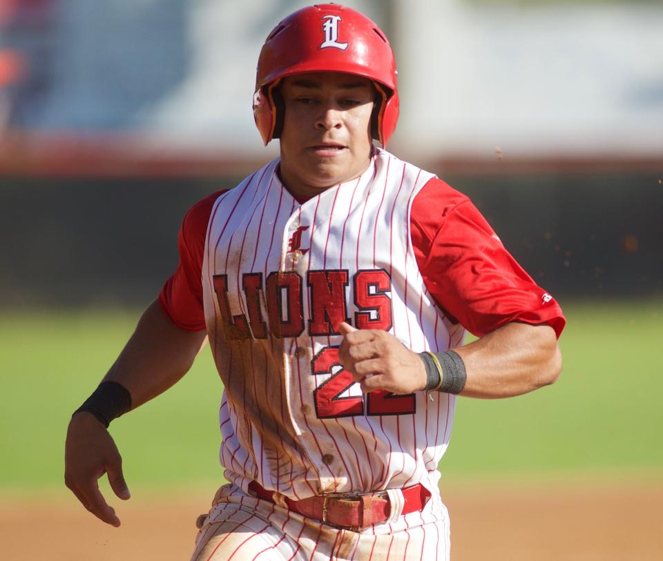 Leon senior Eddie Castillo (22) runs to third base in a game between Leon and Mosley on March 21, 2023, at Leon High School. The Lions won 3-2.