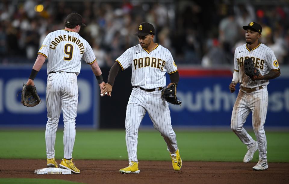 San Diego Padres second baseman Jake Cronenworth, celebrates with center fielder Trent Grisham, right, after defeating the Philadelphia Phillies in a June 24 game.