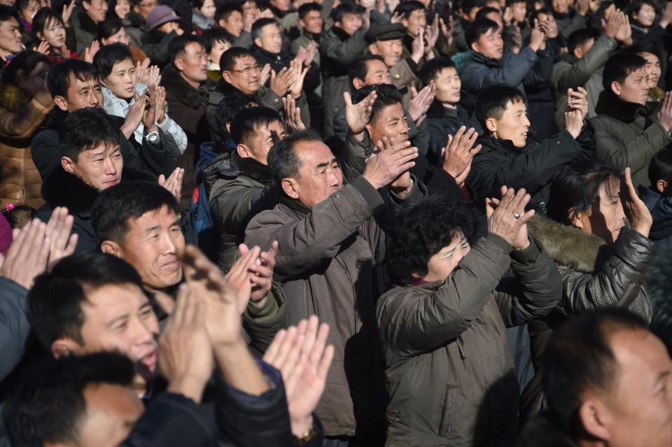 Pyongyang residents react at the Pyongyang Railway Station after the news of the successful launch of the new intercontinental ballistic missile (ICBM) Hwasong-15 in Pyongyang on November 29, 2017. (KIM WON-JIN/AFP/Getty Images)