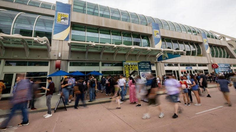 people walking past the convention center