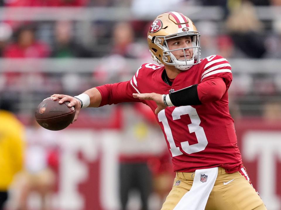 Brock Purdy looks to throw against the Tampa Bay Buccaneers.