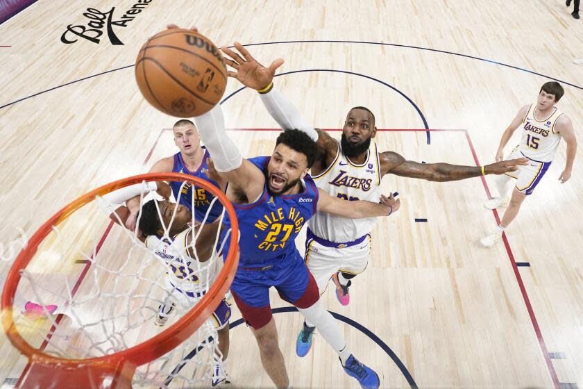 Denver Nuggets guard Jamal Murray (27) goes up to shoot against Los Angeles Lakers.