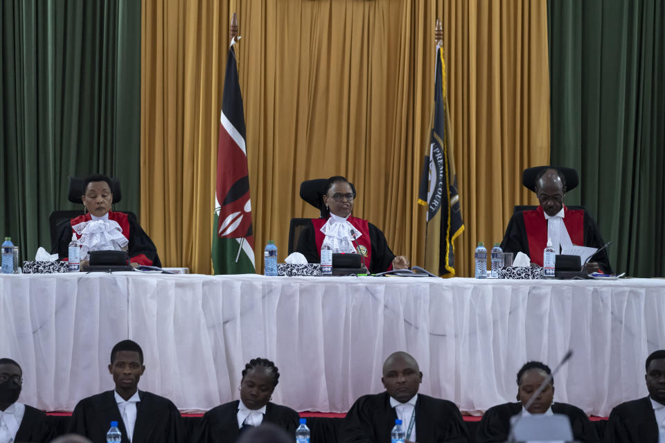 From left to right, Kenya's Supreme Court judges Deputy Chief Justice Philomena Mbete Mwilu, Chief Justice Martha Koome, and Mohammed Khadhar Ibrahim, deliver judgement in the electoral petition at the Supreme Court in Nairobi, Kenya Monday, Sept. 5, 2022. Kenya's Supreme Court on Monday is ruling on challenges to the presidential election in which Deputy President William Ruto was declared the winner by a slim margin and opposition candidate Raila Odinga alleged irregularities in the otherwise peaceful Aug. 9 election. (AP Photo/Ben Curtis)