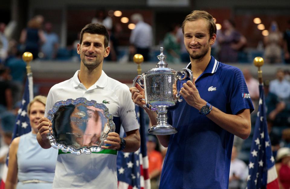 Novak Djokovic (pictured) lost to Daniil Medvedev (pictured right) posing with their trophies at the US Open.