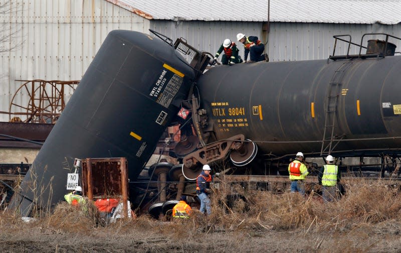 Officials examine a derailed car in Paulsboro on November 30, 2012.