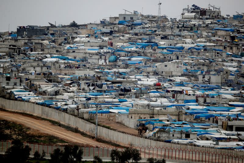 Tents housing internally displaced people in Atma camp in Idlib Governorate of Syria are seen on the Syrian side of the border zone near the Turkish village of Bukulmez in Hatay province