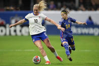 United States' Lindsey Horan (10) shields the ball from against Japan's Yui Hasegawa (14) during the second half in a SheBelieves Cup women’s soccer game, Saturday, April 6, 2024, in Atlanta. The United States won 2-1. (AP Photo/Mike Stewart)