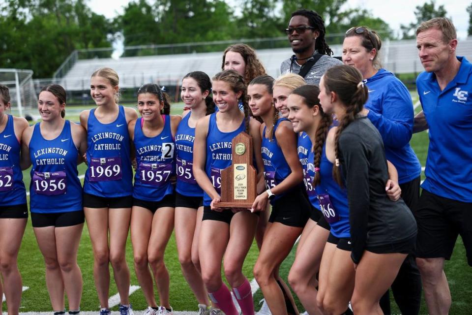 Lexington Catholic’s girls track and field team celebrates winning the Class 2A Region 6 track and field championship at Henry Clay High School on Saturday.