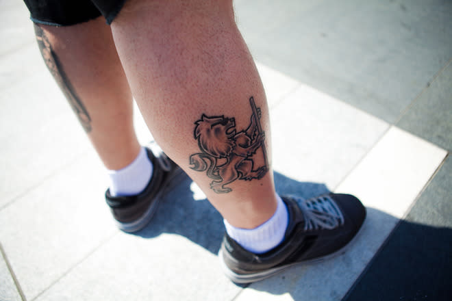 LOS ANGELES, CA - JUNE 11: A dedicated Los Angeles Kings fan displays his new tattoo of the team's crest in front of the Staples Center before the start of Game 6 of the 2012 Stanley Cup Final June 11, 2012 in Los Angeles, California. A win in Game 6 against the New Jersey Devils would lead the Los Angeles Kings to their first championship in franchise history. (Photo by Jonathan Gibby/Getty Images)