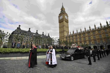 The hearse carrying the coffin of PC Keith Palmer, the officer killed in the March 22 Westminster terror attack, leaves the Chapel of St Mary Undercroft within the Palace of Westminster, heading to his funeral at Southwark Cathedral in central London, Britain April 10, 2017. REUTERS/Ben Stansall/Pool