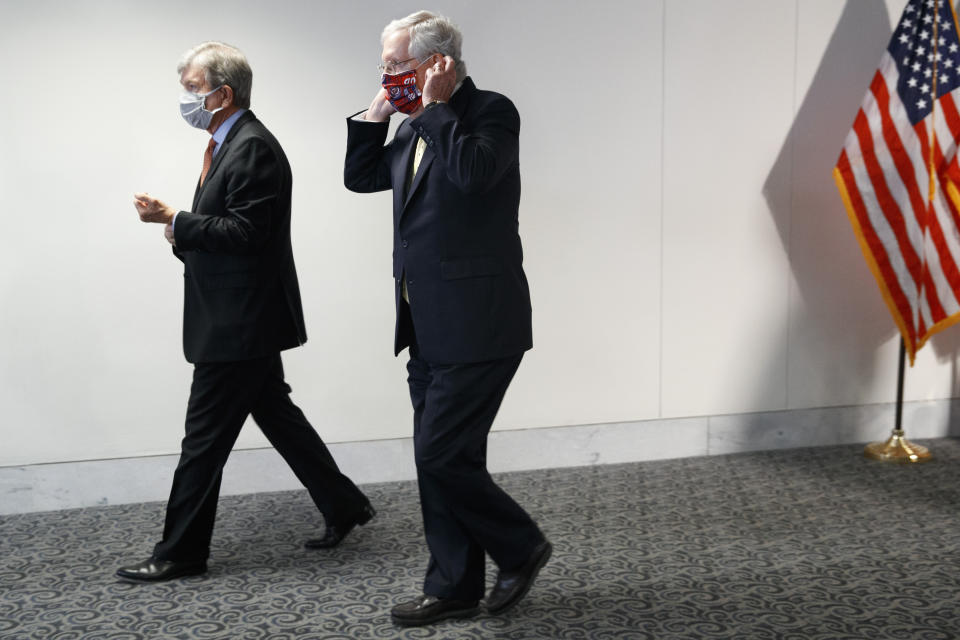 Sen. Roy Blunt, R-Mo., left, and Senate Majority Leader Mitch McConnell of Ky., leave a news conference after a Republican luncheon, Tuesday, July 21, 2020, on Capitol Hill in Washington. (AP Photo/Jacquelyn Martin)