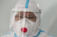 Dr. Tatyana Symbelova speaks during a daily examination of patients suspected of having coronavirus in the red zone of the hospital in Ulan-Ude, the regional capital of Buryatia, a region near the Russia-Mongolia border, Russia, Friday, Nov. 20, 2020. Symbelova told the AP that as the number of patients rose, her hospital kept adding beds — “in the corridor, in the outpatient ward next door” — but “the situation, still, grew worse and worse.” (AP Photo/Anna Ogorodnik)