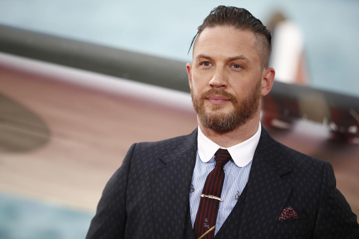 British actor Tom Hardy poses for a photograph upon arrival for the world premiere of 