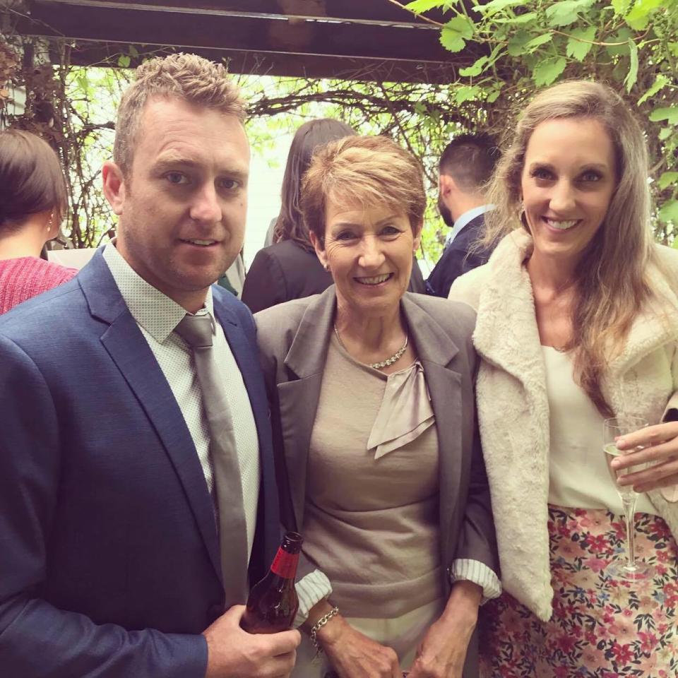 Jarrod is pictured posing in a suit with his mum Cheryl and sister Erin. Source: Supplied