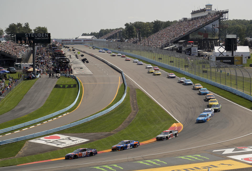 Denny Hamlin (11), Chase Elliott (9) and Erik Jones (20) come around Turn 1 during a NASCAR Cup Series auto race, Sunday, Aug. 5, 2018, in Watkins Glen, N.Y. (AP Photo/Julie Jacobson)