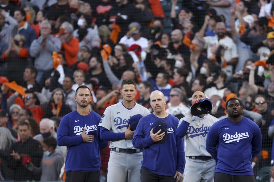 Dodgers' Corey Seager and Mookie Betts stand for the national anthem.