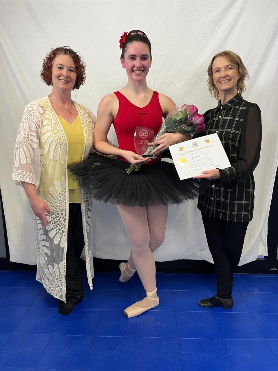 Brianna Dash, 20, passed the Advanced Solo Award Ballet exam in March after months of training with her dance instructor of 17 years Melissa Wallace, left, in Swift Current, Sask. (Creative Kids - image credit)