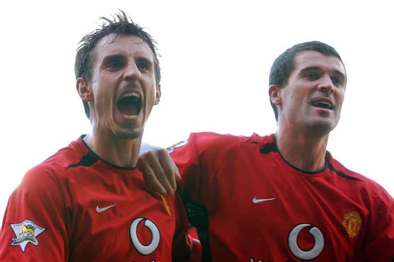 Manchester United's Roy Keane celebrates with team-mate Gary Neville (left), after scoring against Leeds United during their Barclaycard Premiership match at Elland Road, Leeds, Saturday October 18, 2003. Manchester United won  1-0. PA Photo: John Giles.