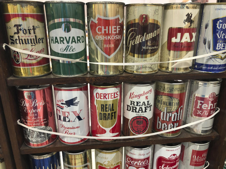 Vintage mid-century beer cans are on display Thursday, Aug. 29, 2019, in Albuquerque, N.M., at the 49th annual gathering of members of the Brewery Collectibles Club of America. Collectors from around the world began Thursday buying, trading and selling containers of brews at the annual four-day event billed the "CANvention." (AP Photo/Russell Contreras)