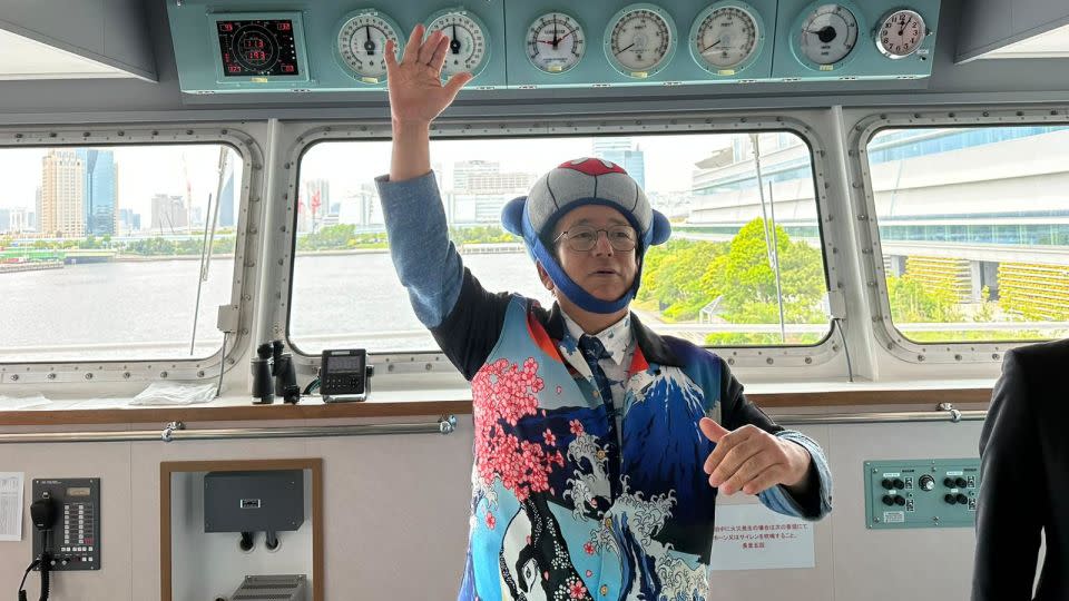 Kyodo Senpaku’s president Hideko Tokoro, wearing a toy whale hat, speaks to the media on board the Kangei Maru vessel in Tokyo harbor on 23 May, 2024. - Hanako Montgomery/CNN