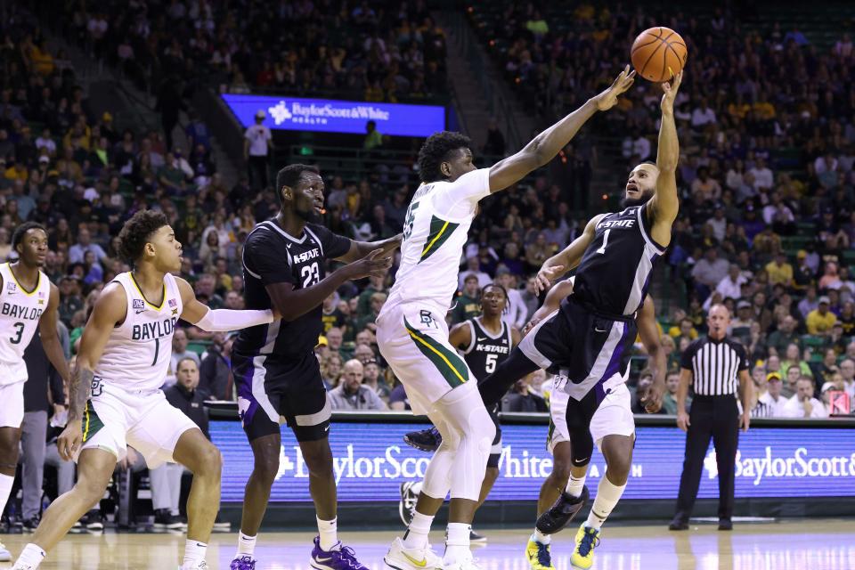 Kansas State guard Markquis Nowell (1) shoots to score over Baylor forward Josh Ojianwuna (15) in the first half of an NCAA college basketball game, Saturday, Jan. 7, 2023, in Waco, Texas. (AP Photo/Rod Aydelotte)