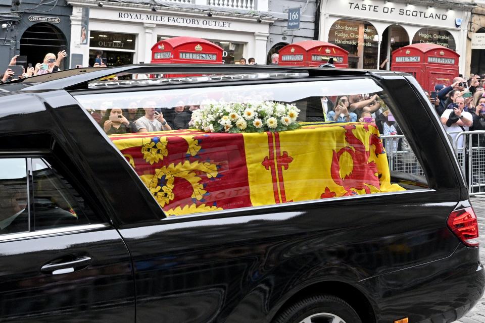 The Queen’s funeral cortege proceeds down The Royal Mile