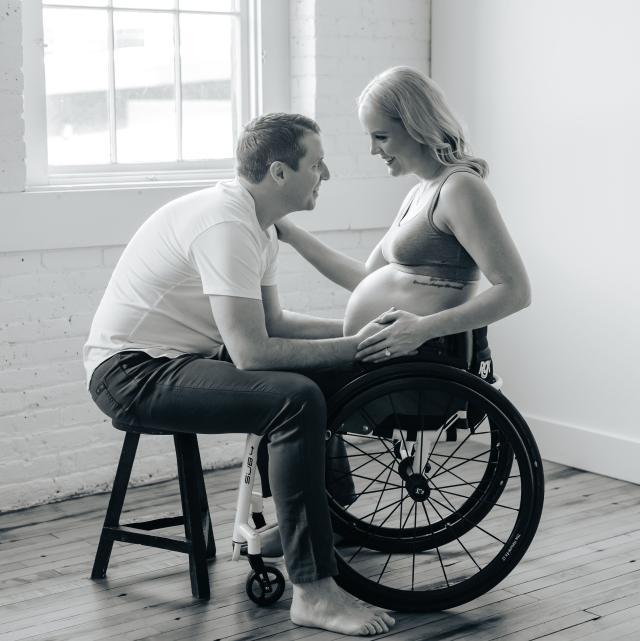Mallory Weggemann and Jay Snyder look at each other in a black and white photo during pregnancy