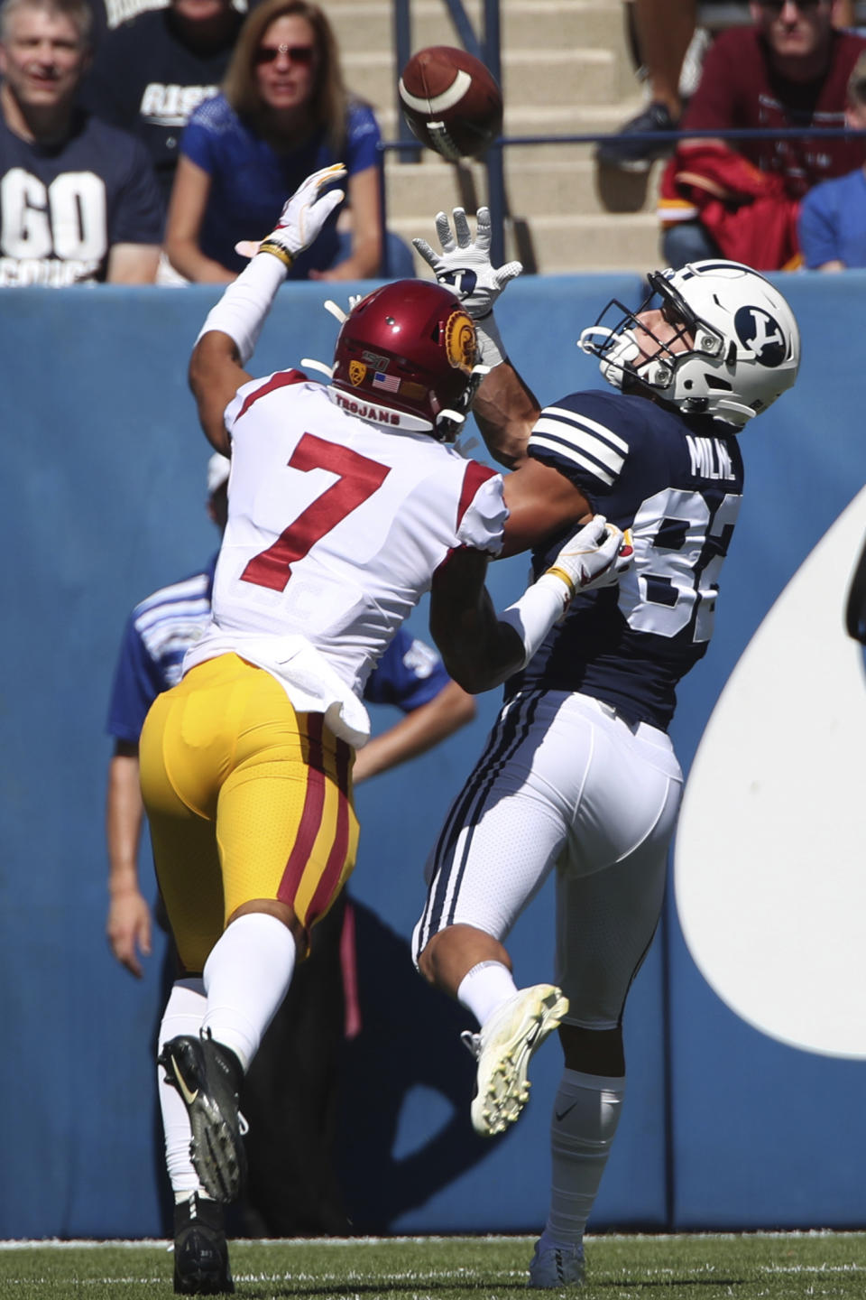 BYU wide receiver Dax Milne (82) catches a touchdown pass over Southern California cornerback Chase Williams (7) in the first half of an NCAA college football game, Saturday, Sept. 14, 2019, in Provo, Utah. (AP Photo/George Frey)