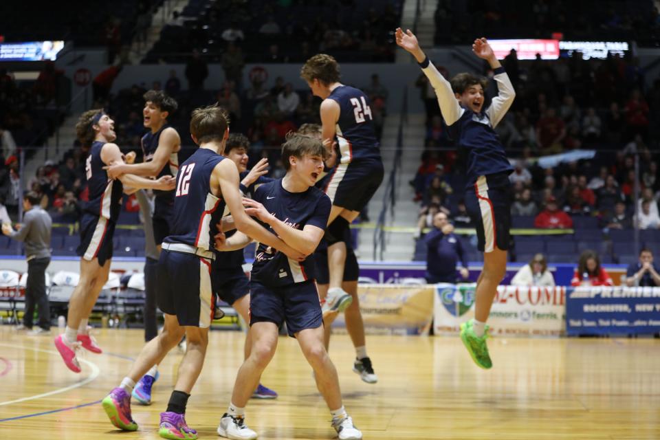 Mynderse Academy celebrates on the floor their Class B1 Section V championship at Blue Cross Arena.