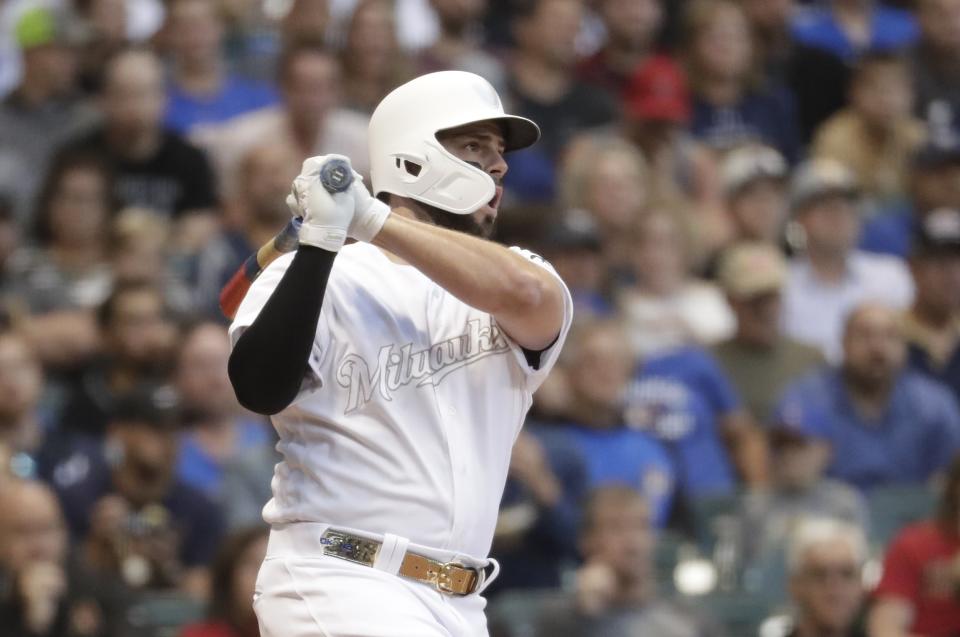 Milwaukee Brewers' Mike Moustakas hits a two-run scoring double during the first inning of a baseball game against the Arizona Diamondbacks Friday, Aug. 23, 2019, in Milwaukee. (AP Photo/Morry Gash)
