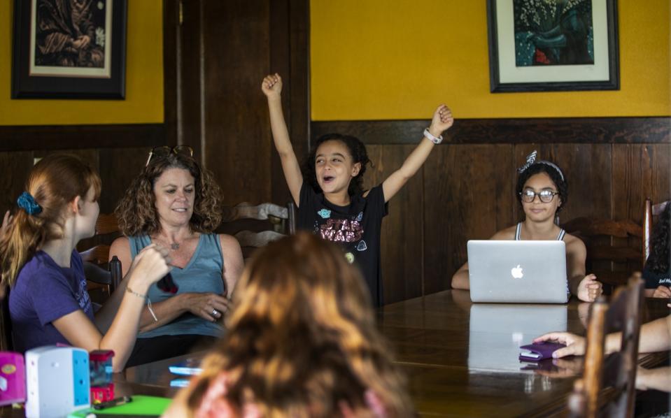 Allison Furbush cheers thinking that PE is next on the schedule after science class.